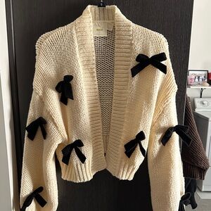 Anthropologie Cream Cardigan with Black Bow Accents